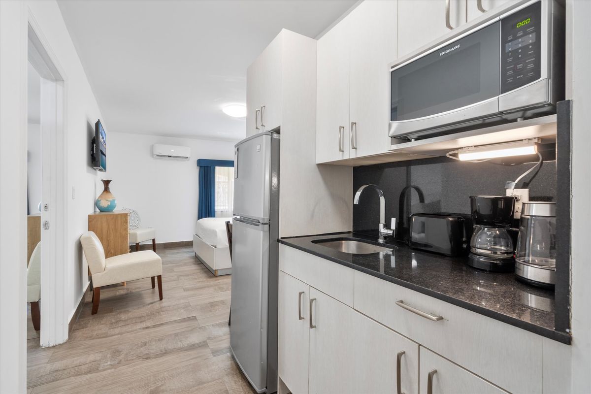 Kitchen, with the sitting room beyond