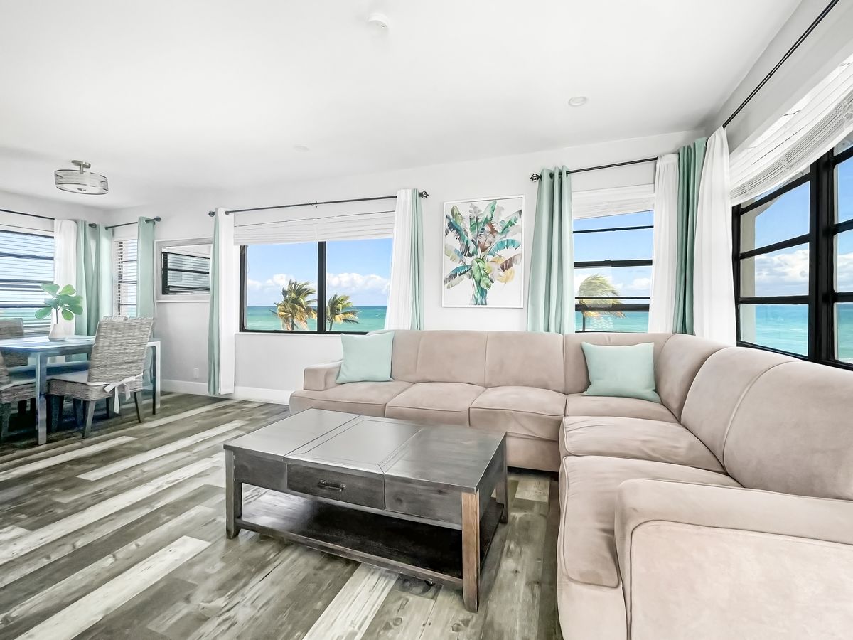 Living room with the ocean in the window